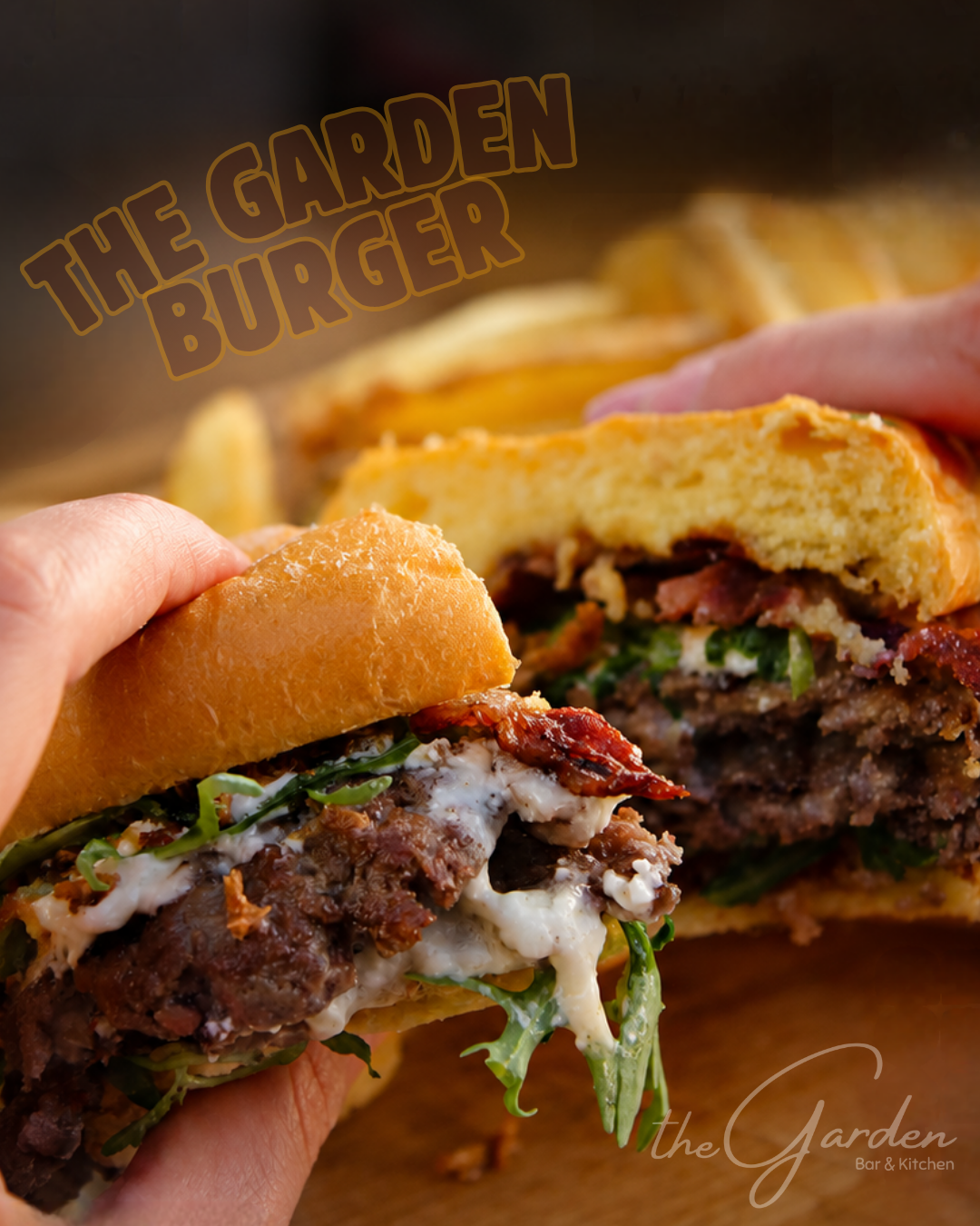 The Garden Burger with double beef patty, bacon, Florin pepper jam, feta mousse, rocket, and crispy onions at The Garden Bar & Kitchen.