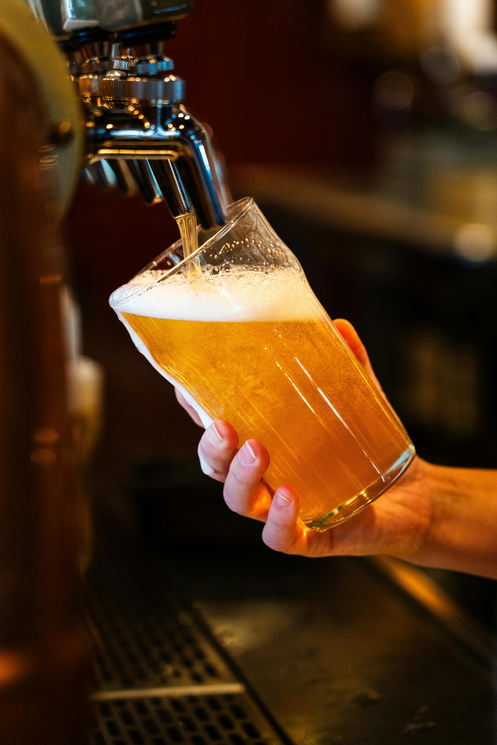 Fresh draft beer being poured at The Garden Kos – best restaurant in Kos Greece for drinks and dining
